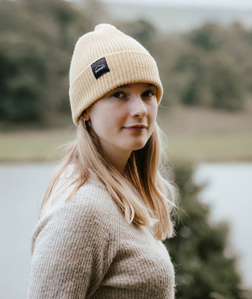 A simple, timeless ribbed Bunnet beanie in a soft, natural neutral inspired by Scottish oats and dried grasses.